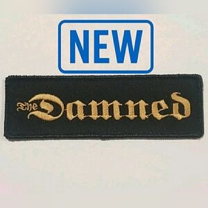 The Damned Band Logo Patch Embroidered Sew-On Black Gold Gothic Font Woven